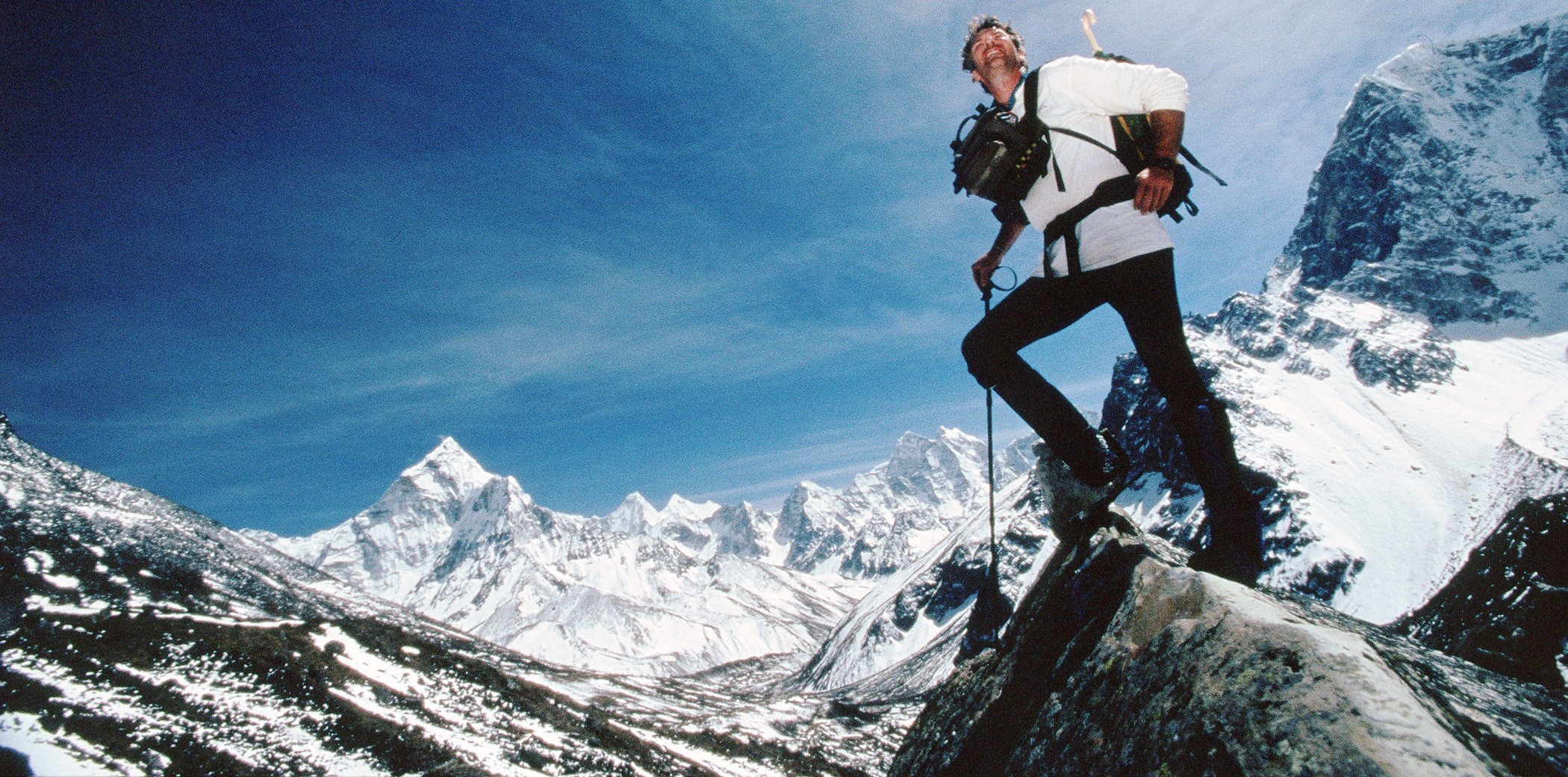 Trekking into Everest base camp Tom Whittaker is surrounded by Himalayan peaks.